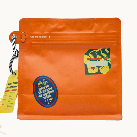 桔 (jú) next to the orange tree